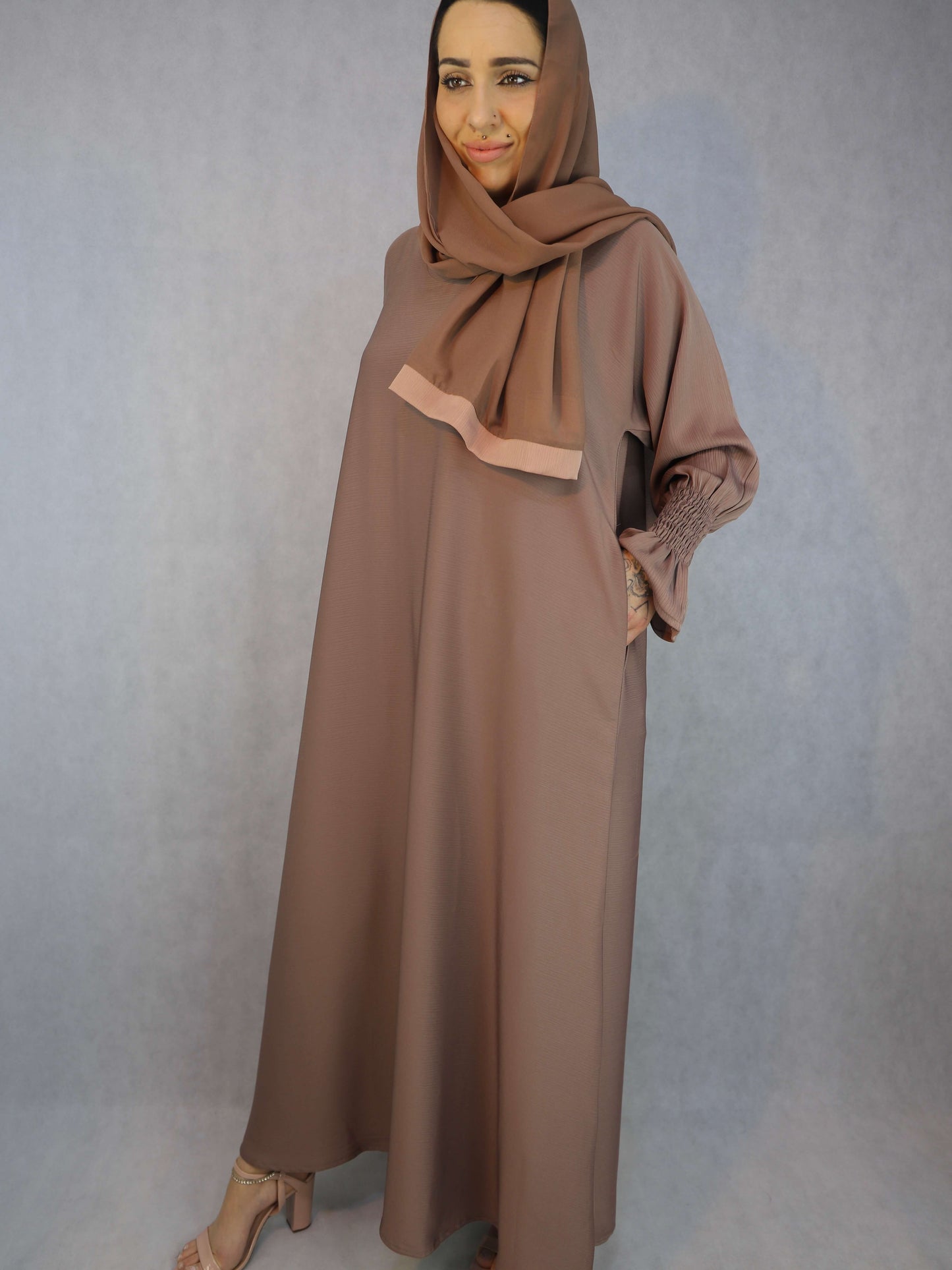 Zoom Material Abaya With Elasticated Sleeves.